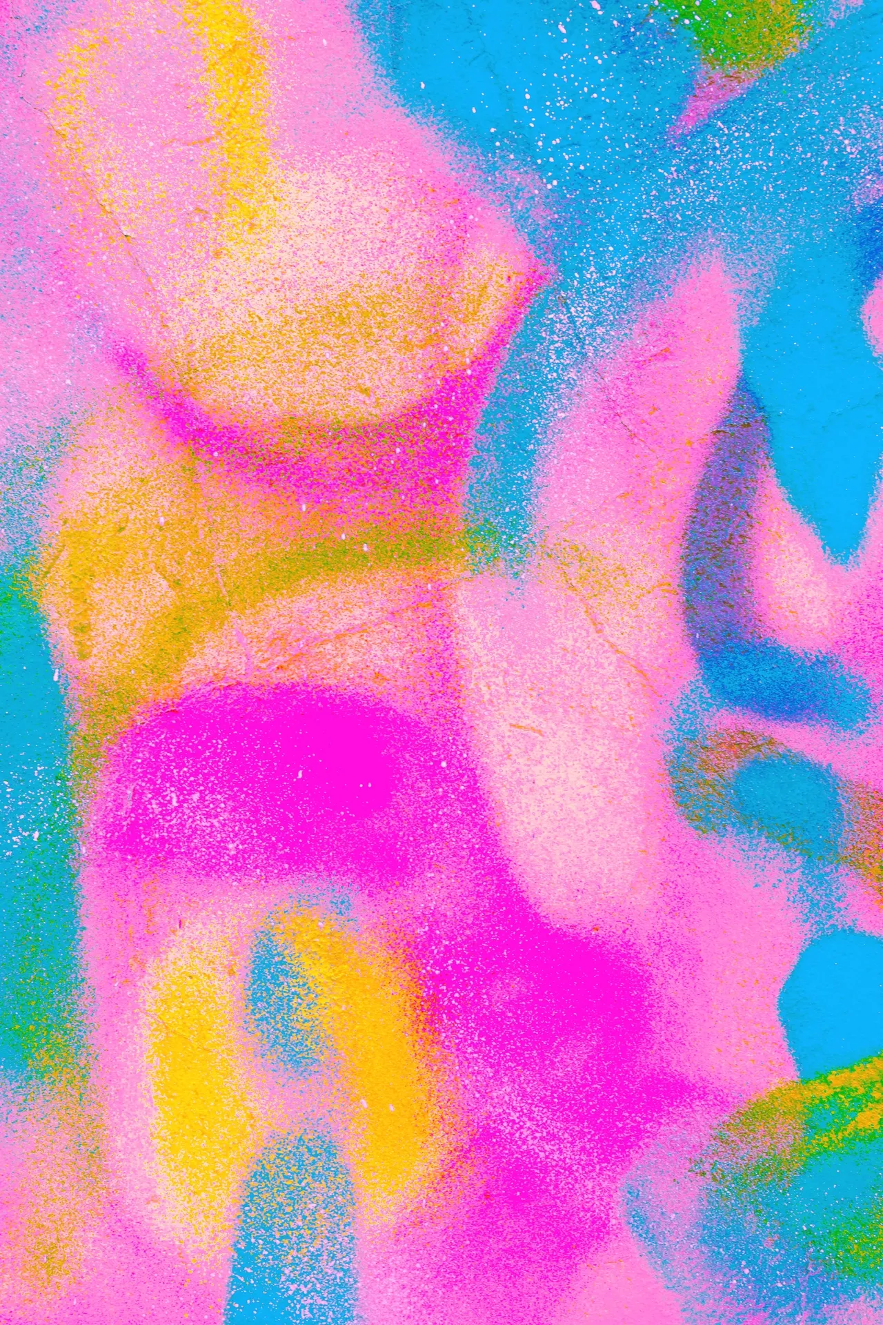 Wall with pink and cyan neon spray